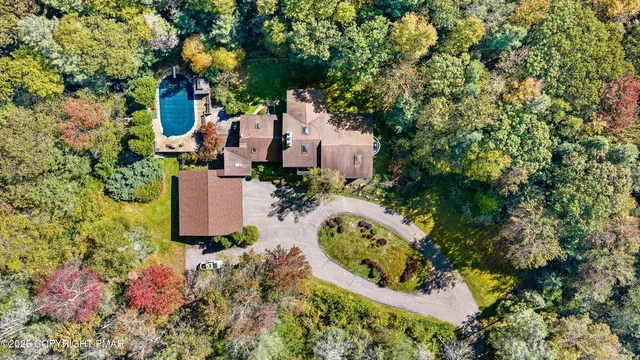 a bedroom with two beds and a window