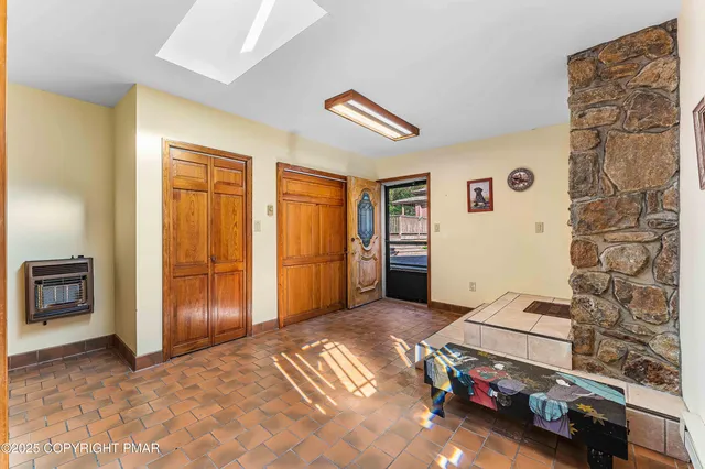 an empty room with furniture and a fireplace