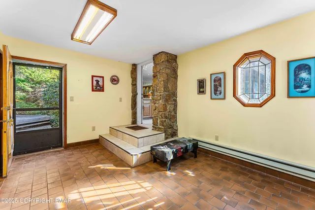 a view of a livingroom with furniture and a ceiling fan