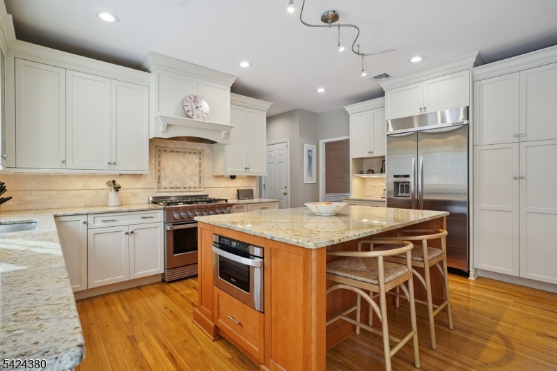 13 O'Brien Court Bedminster, NJ 07921 - Photo 13 of 50 a kitchen with stainless steel appliances granite countertop a stove and a sink