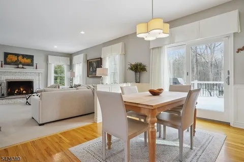 a view of a livingroom with furniture window and wooden floor