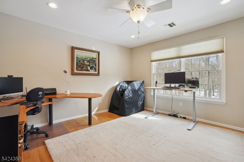 13 O'Brien Court Bedminster, NJ 07921 - Photo 36 of 50 a bedroom with furniture and a flat screen tv