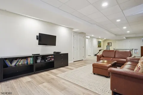 a room with furniture pool table and windows