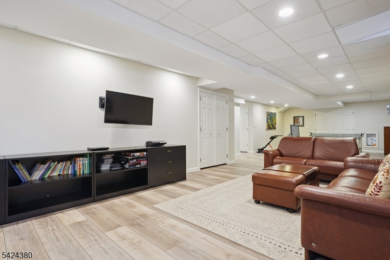 13 O'Brien Court Bedminster, NJ 07921 - Photo 42 of 50 a living room with furniture and a flat screen tv