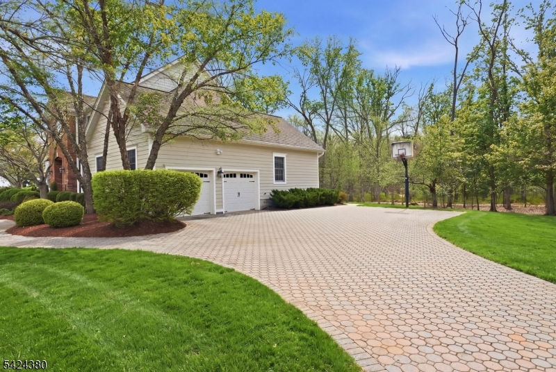 13 O'Brien Court Bedminster, NJ 07921 - Photo 45 of 50 a front view of a house with a yard and garage