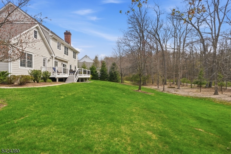 13 O'Brien Court Bedminster, NJ 07921 - Photo 47 of 50 a view of a big building with a big yard and large trees