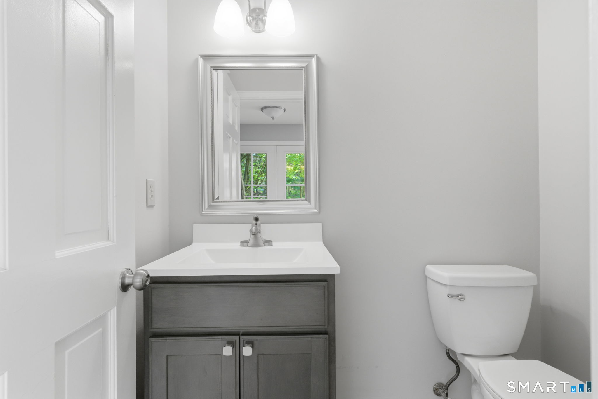 21 Greenwood Road North Granby, CT 06060 - Photo 20 of 40 a bathroom with a toilet sink and mirror