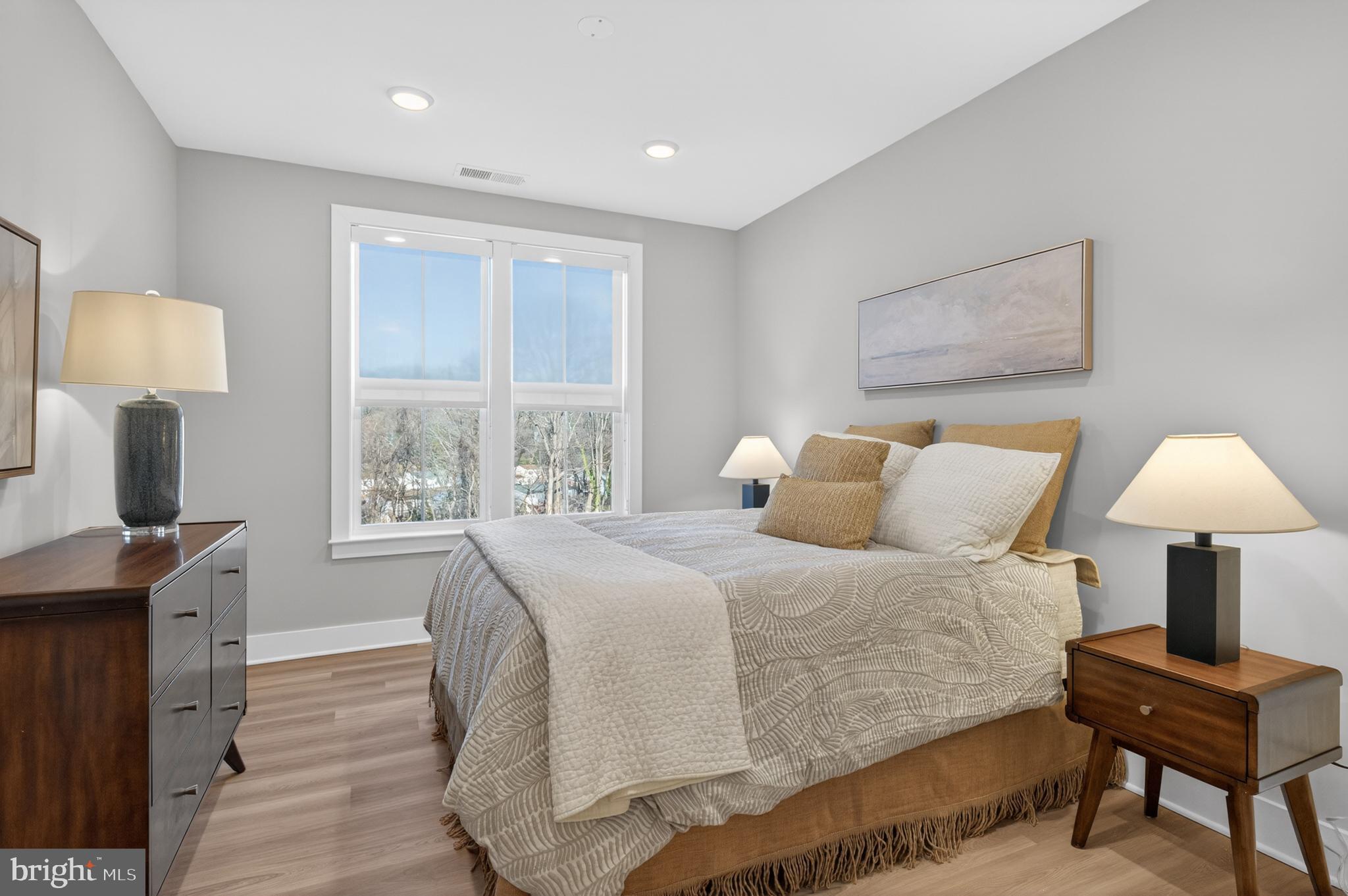 76 Old Mill Bottom Road North, Unit 203 Annapolis, MD 21409 - Photo 10 of 50 a bedroom with a bed and a window