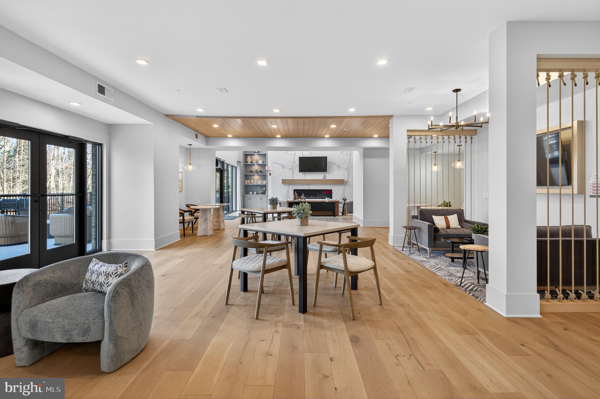 76 Old Mill Bottom Road North, Unit 203 Annapolis, MD 21409 - Photo 32 of 50 a living room with furniture and a flat screen tv