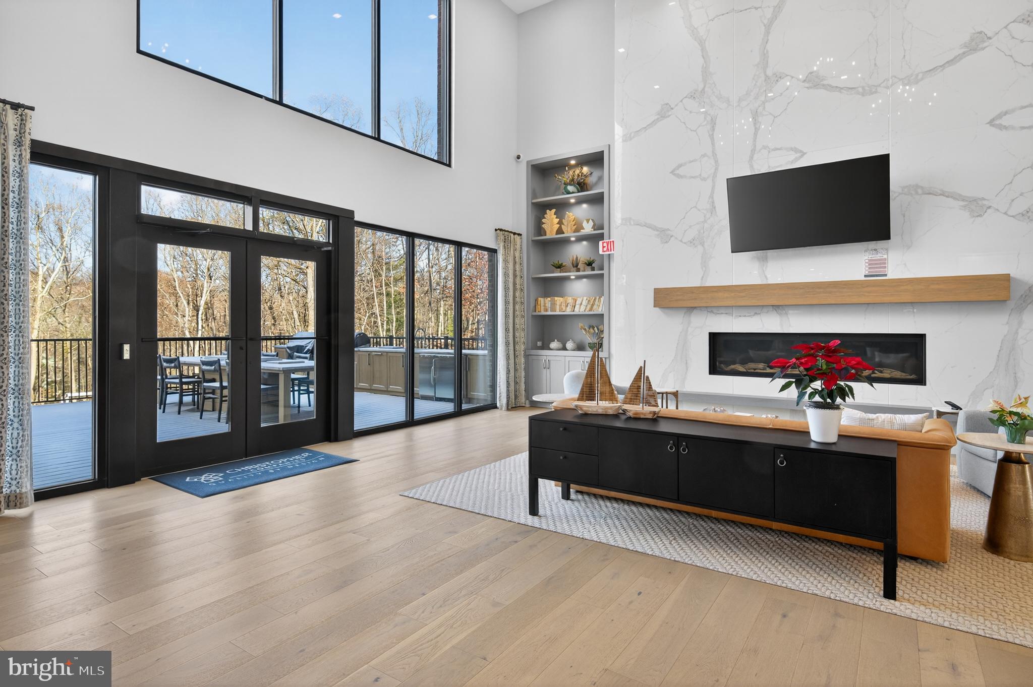 76 Old Mill Bottom Road North, Unit 203 Annapolis, MD 21409 - Photo 33 of 50 a living room with furniture and a flat screen tv