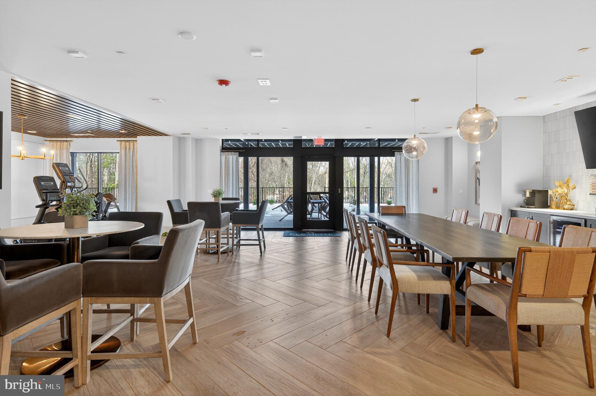 76 Old Mill Bottom Road North, Unit 203 Annapolis, MD 21409 - Photo 38 of 50 a view of a a dining room with furniture window and wooden floor