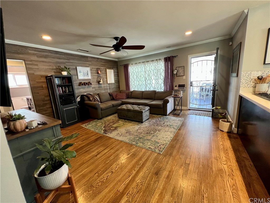 3713 North Studebaker Road Long Beach, CA 90808 - Photo 3 of 15 a living room with furniture and a flat screen tv
