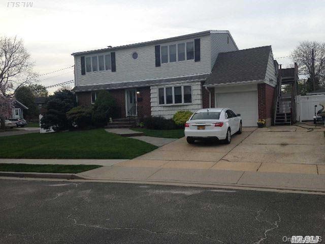 6 David Road Plainview, NY 11803 - Photo 1 of 1 a car parked in front of white house