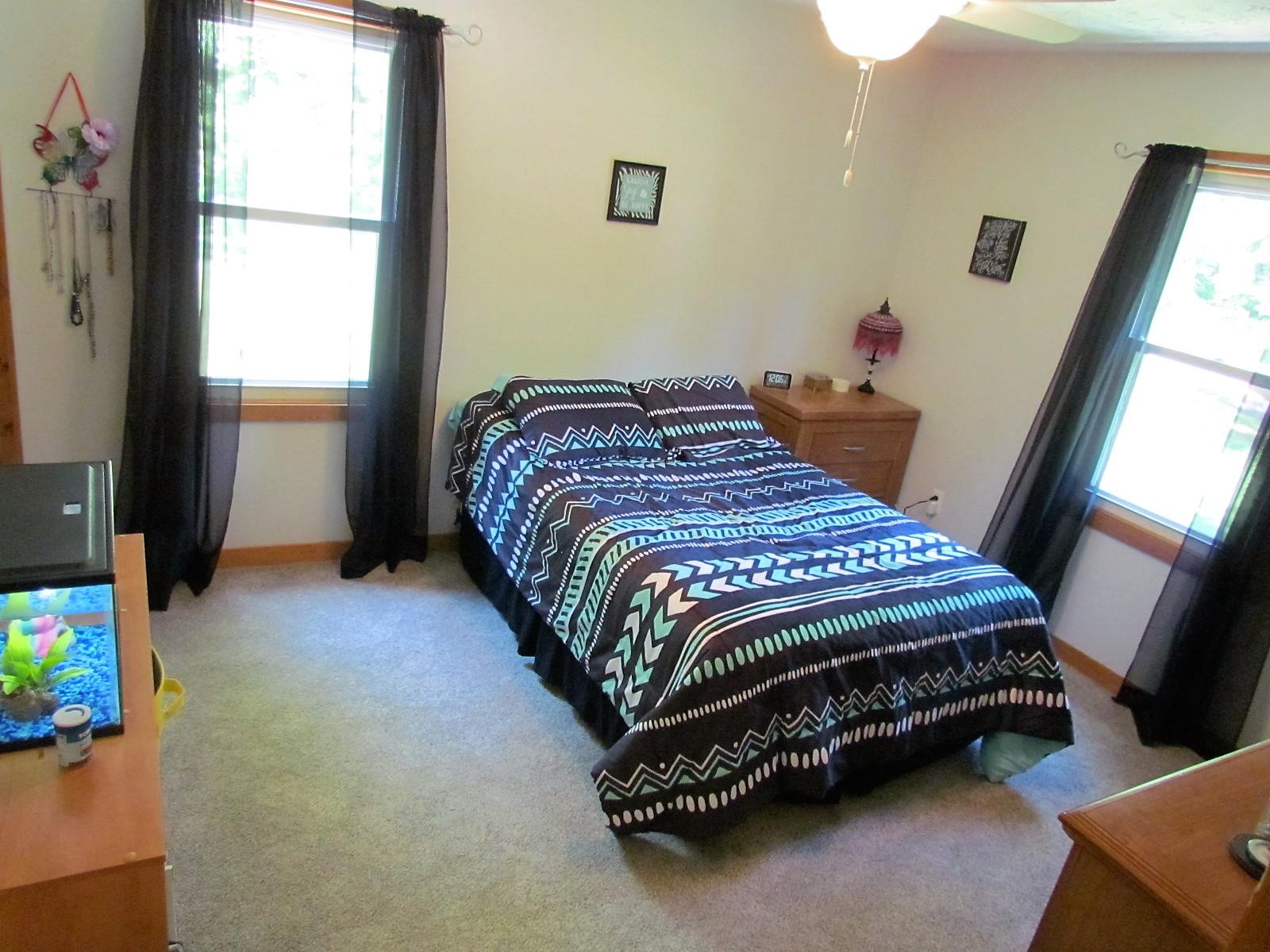 81 Jamison Mill Road Henry, VA 24102 - Photo 13 of 28 a bedroom with a bed and a window