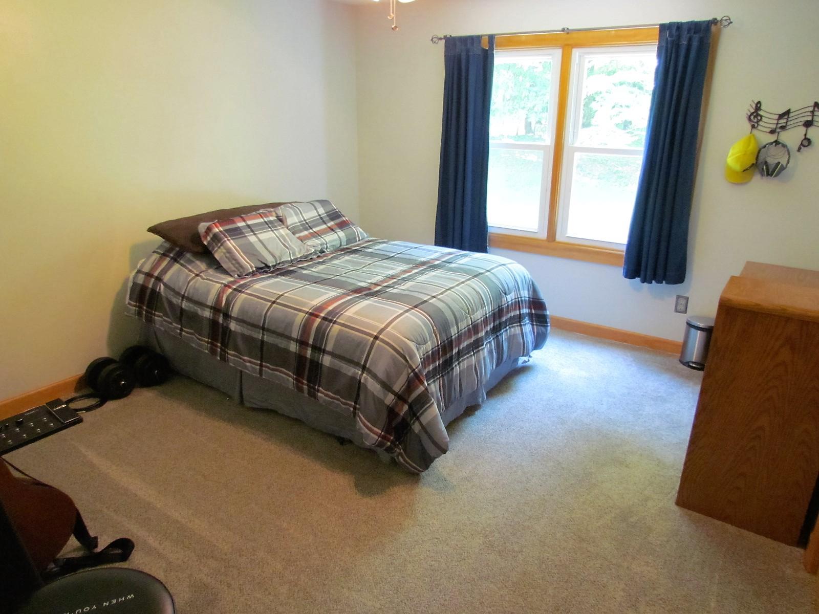 81 Jamison Mill Road Henry, VA 24102 - Photo 15 of 28 a spacious bedroom with a bed and a window