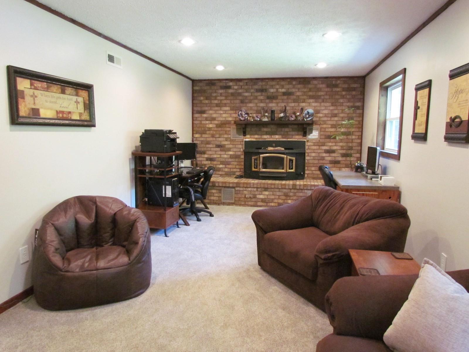 81 Jamison Mill Road Henry, VA 24102 - Photo 19 of 28 a living room with furniture and a fireplace