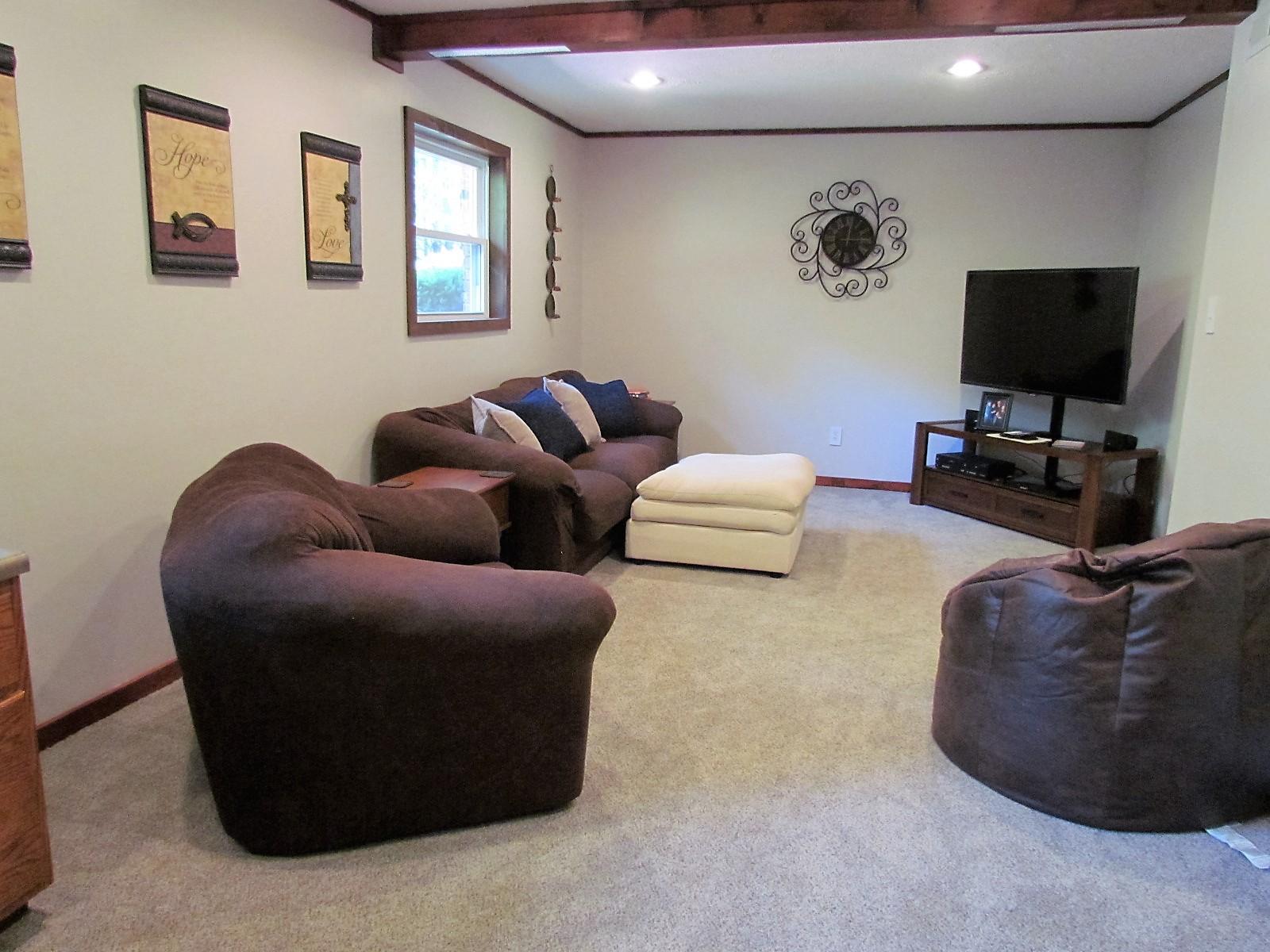 81 Jamison Mill Road Henry, VA 24102 - Photo 20 of 28 a living room with furniture and a flat screen tv