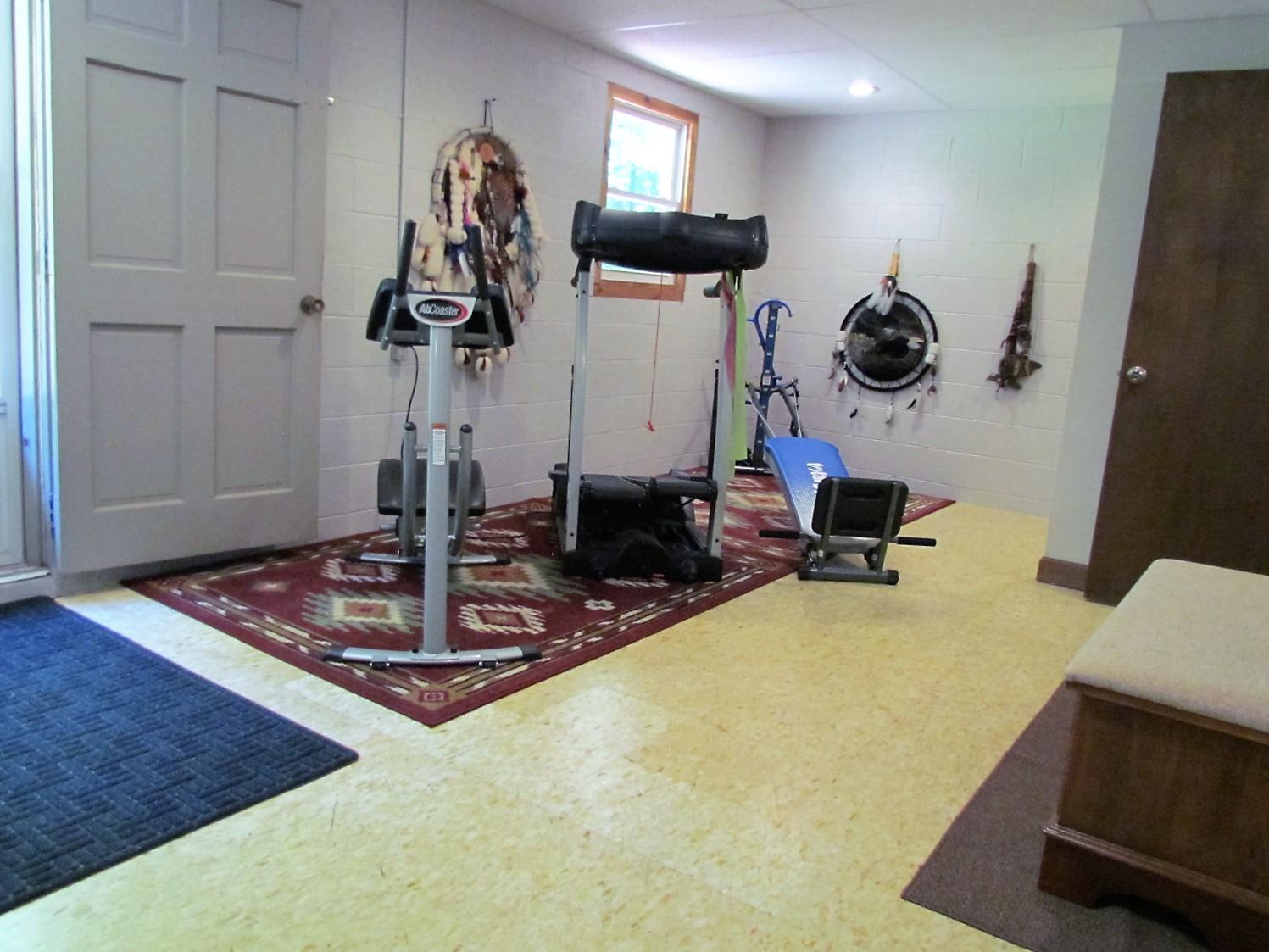 81 Jamison Mill Road Henry, VA 24102 - Photo 22 of 28 a room with a table and gym equipment
