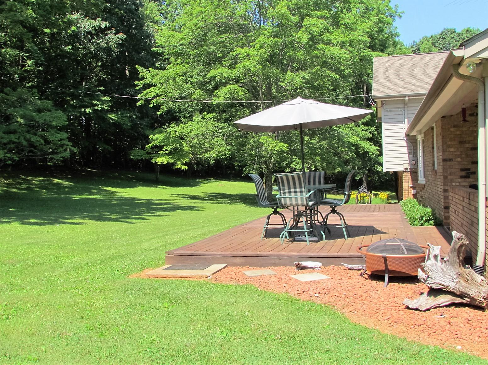 81 Jamison Mill Road Henry, VA 24102 - Photo 24 of 28 a view of a house with backyard porch and sitting area
