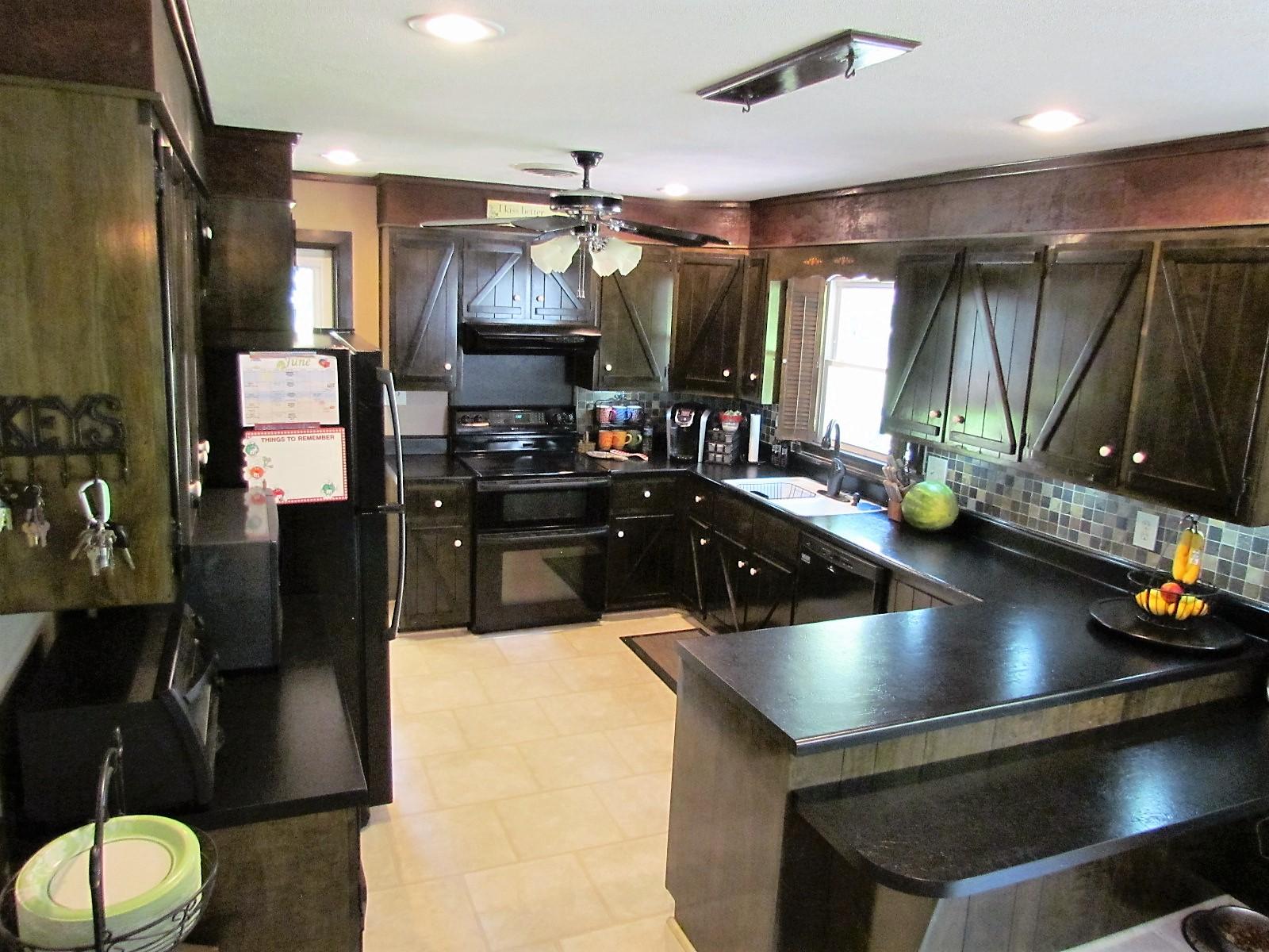 81 Jamison Mill Road Henry, VA 24102 - Photo 4 of 28 a kitchen with a sink appliances and a counter top space