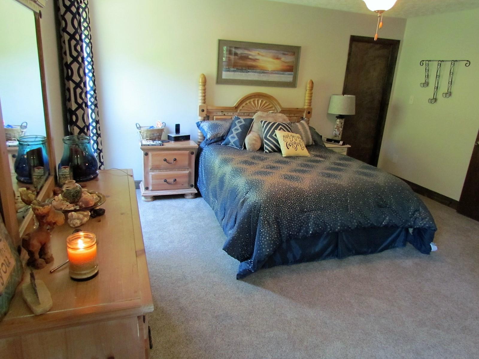 81 Jamison Mill Road Henry, VA 24102 - Photo 8 of 28 a bedroom with a bed and wooden floor