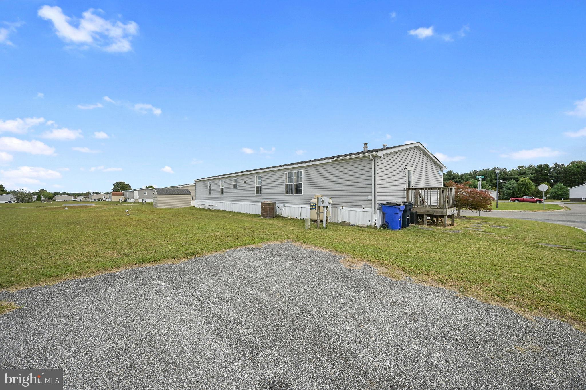 158 Caveat Road, Unit 200 Magnolia, DE 19962 - Photo 17 of 17 a view of a house with backyard and garden