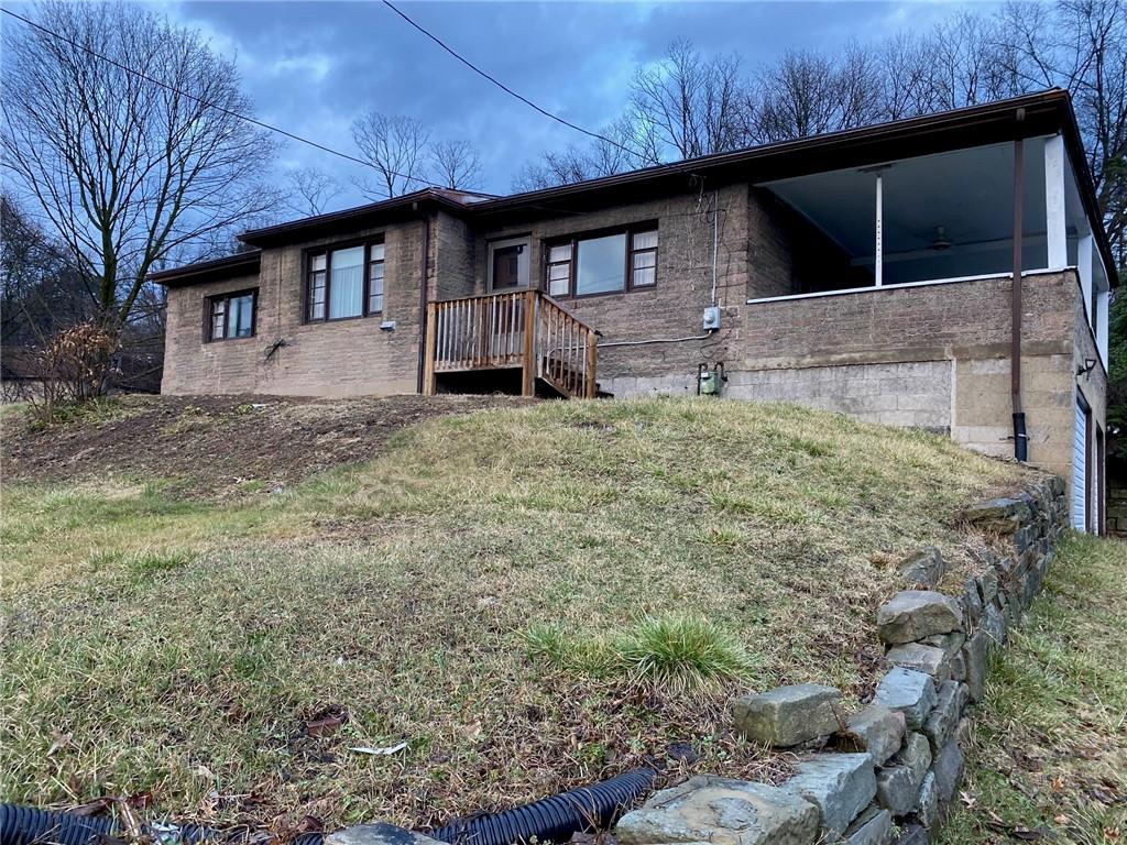 409 Rodi Road Pittsburgh, PA 15235 - Photo 1 of 22 a front view of a house with garden