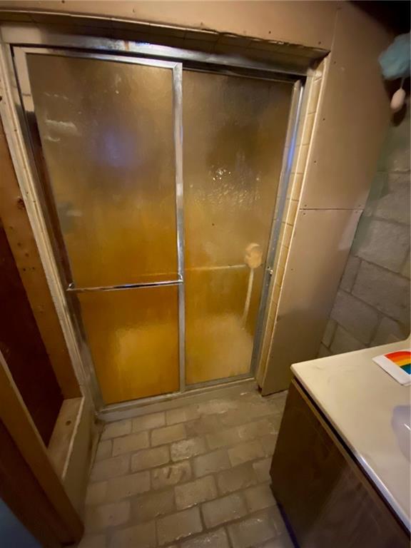 409 Rodi Road Pittsburgh, PA 15235 - Photo 14 of 22 a bathroom with a shower and a glass door