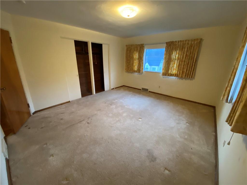 409 Rodi Road Pittsburgh, PA 15235 - Photo 17 of 22 a view of an empty room with a window