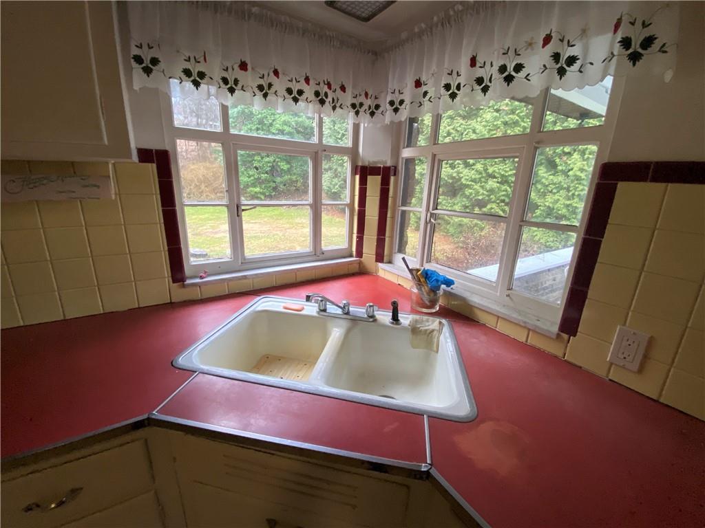 409 Rodi Road Pittsburgh, PA 15235 - Photo 7 of 22 a living room with furniture and a window