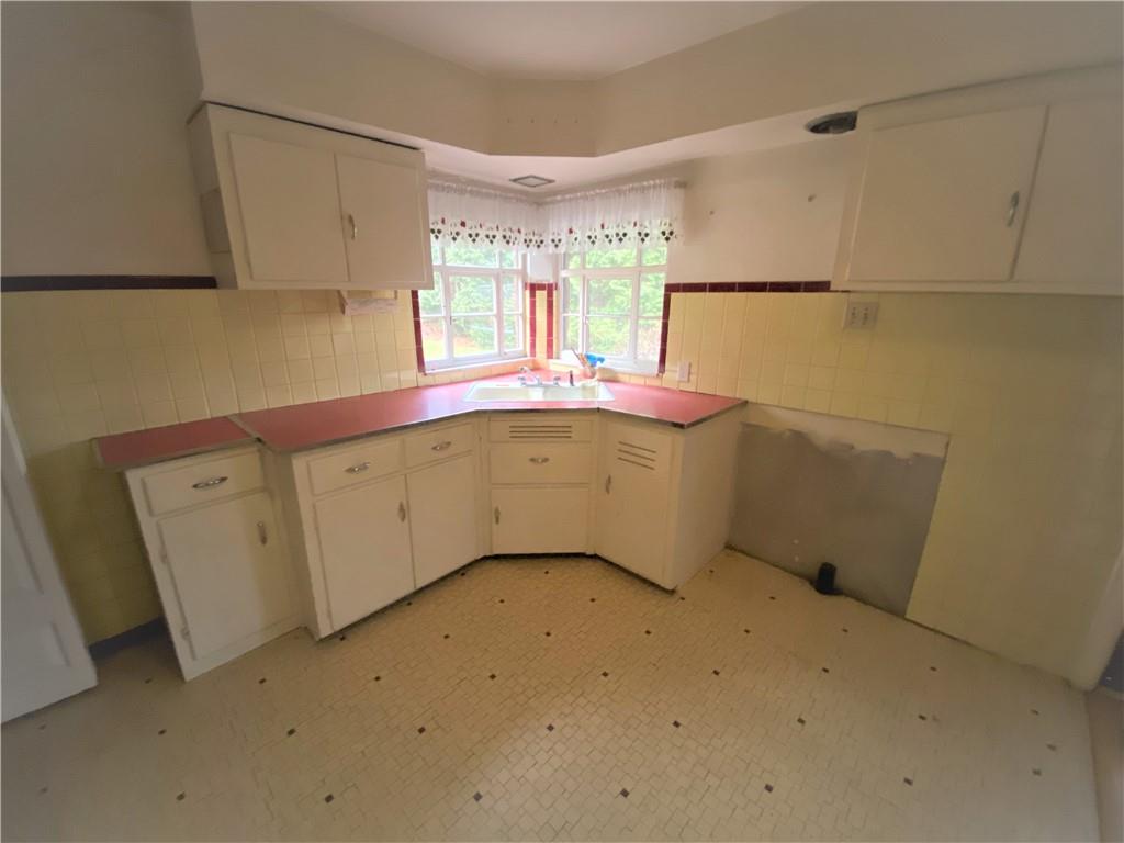 409 Rodi Road Pittsburgh, PA 15235 - Photo 9 of 22 a utility room with a sink washer and dryer