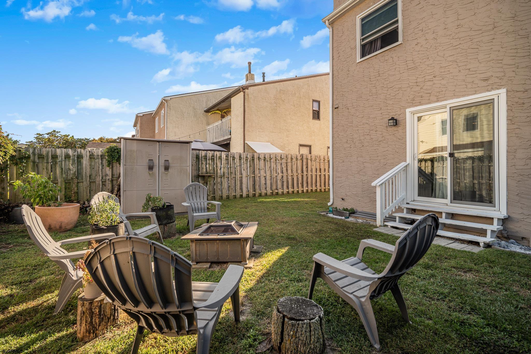 72 Delmar Drive Brigantine, NJ 08203 - Photo 14 of 29 a view of a patio with table and chairs with wooden floor and fence