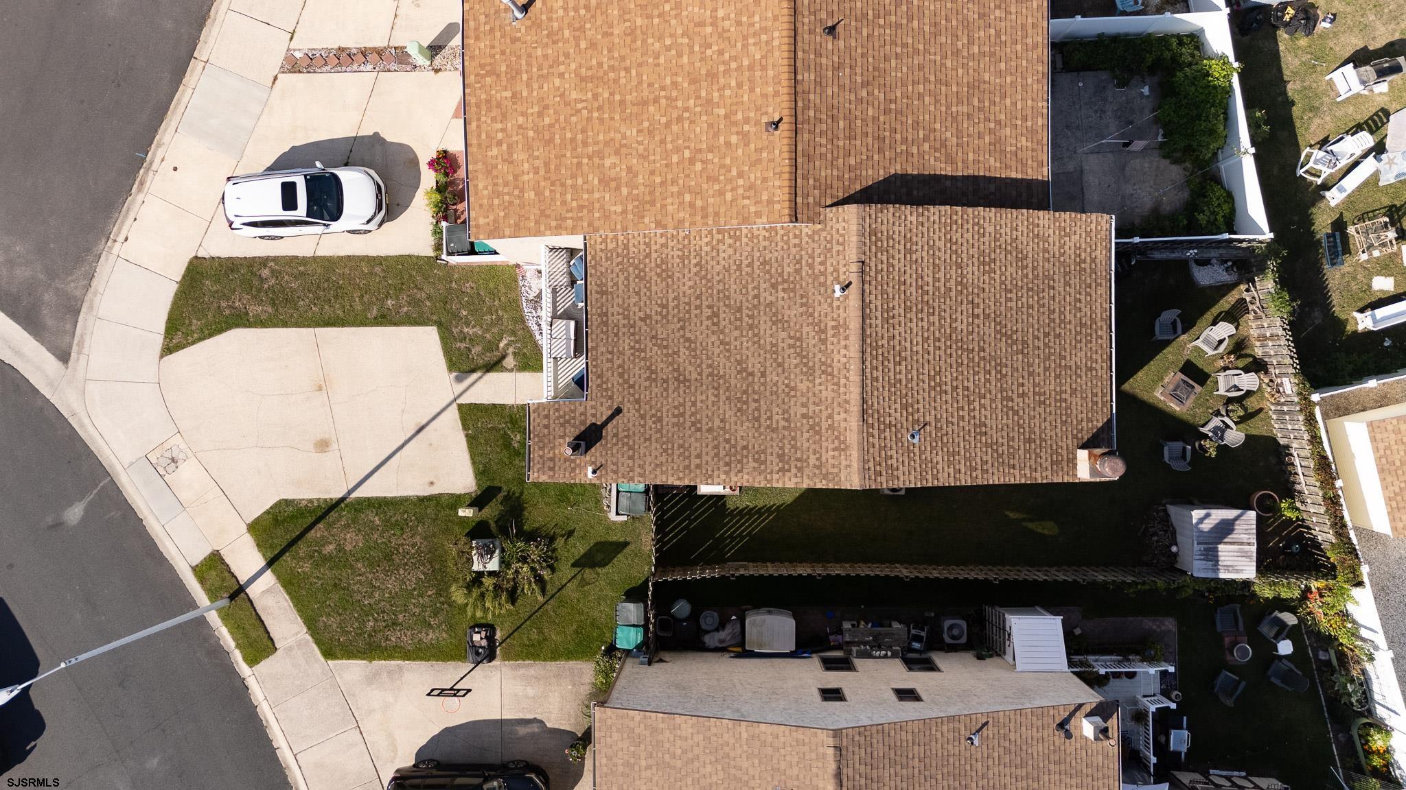 72 Delmar Drive Brigantine, NJ 08203 - Photo 28 of 29 a front view of a house with a garden
