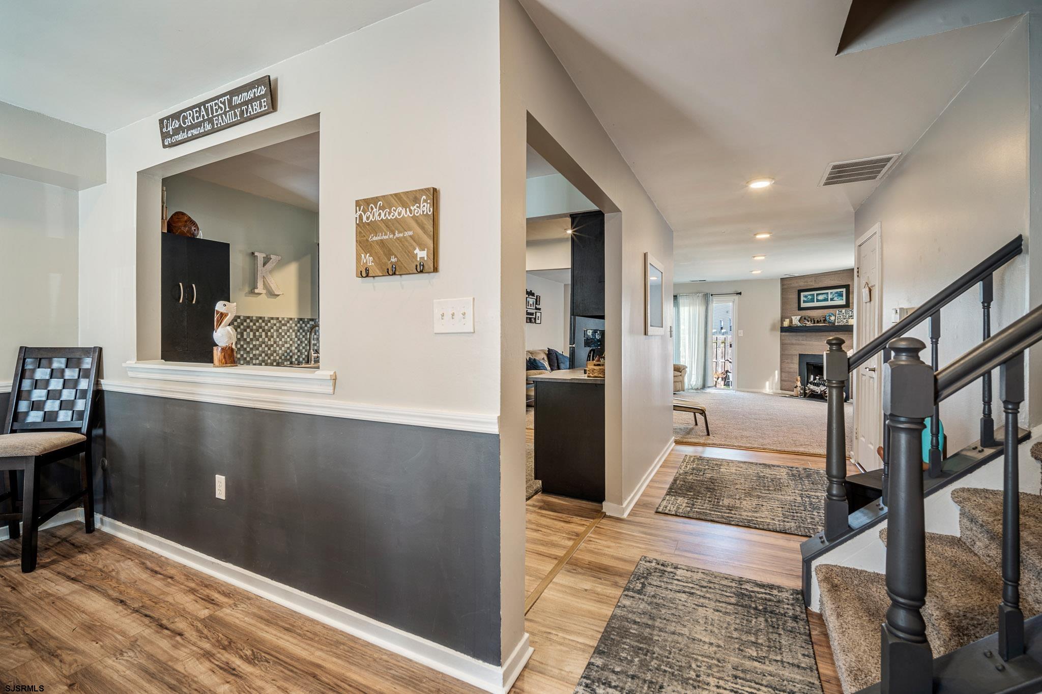 72 Delmar Drive Brigantine, NJ 08203 - Photo 6 of 29 a living room with stainless steel appliances kitchen island granite countertop furniture and a rug