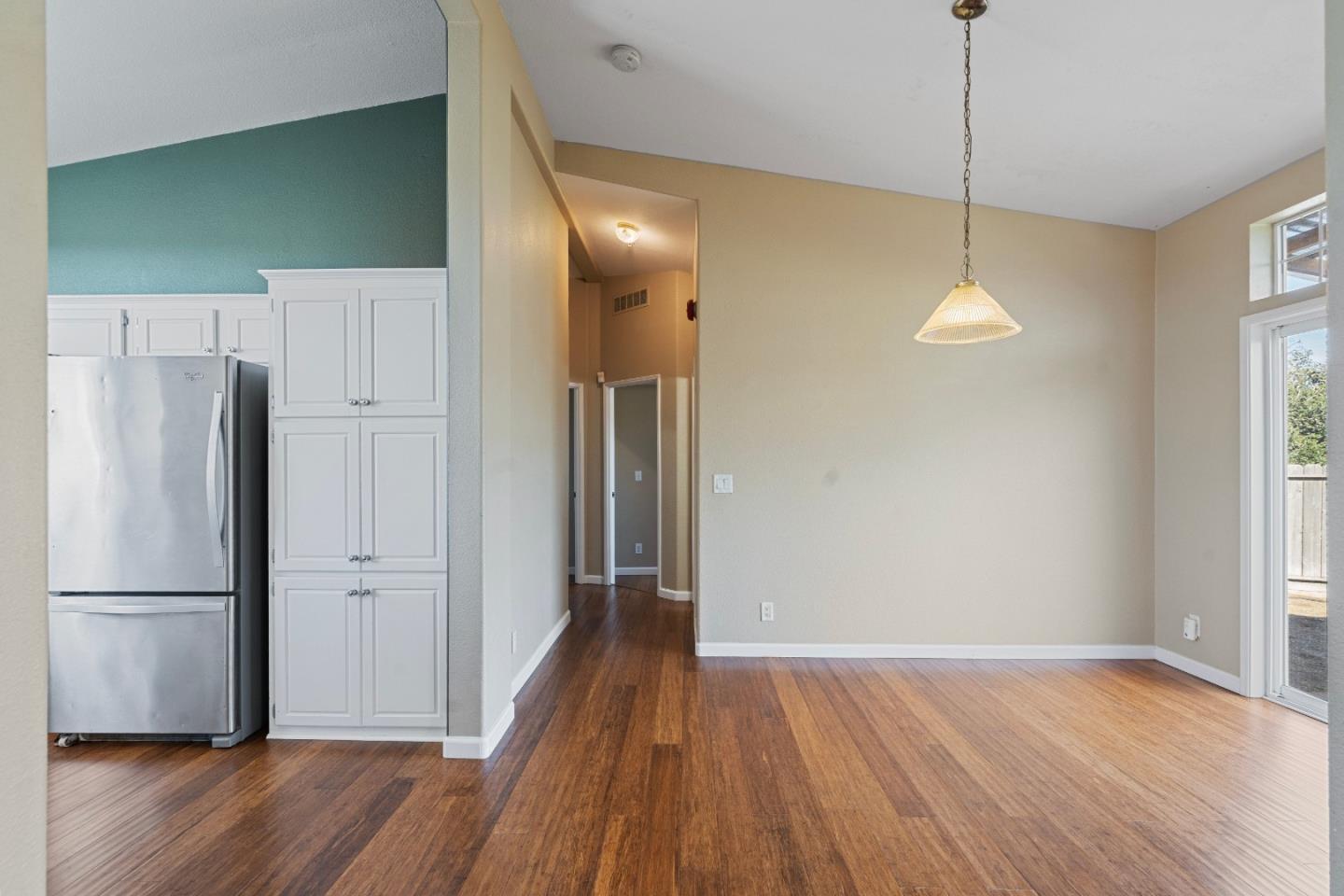 10114 Reese Circle Salinas, CA 93907 - Photo 17 of 43 a view of a kitchen with wooden floor and a ceiling fan