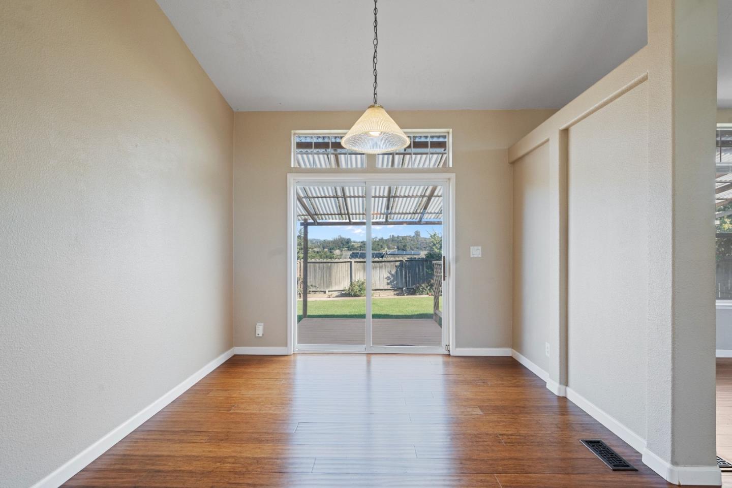 10114 Reese Circle Salinas, CA 93907 - Photo 18 of 43 a view of an empty room with wooden floor and a window
