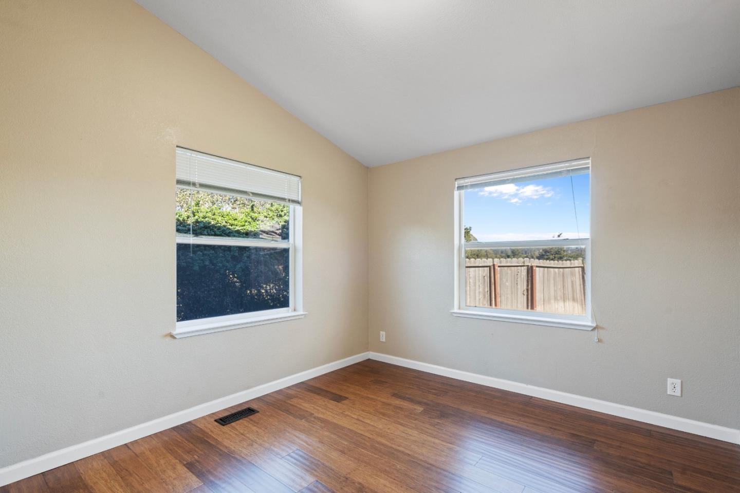 10114 Reese Circle Salinas, CA 93907 - Photo 22 of 43 an empty room with wooden floor and windows