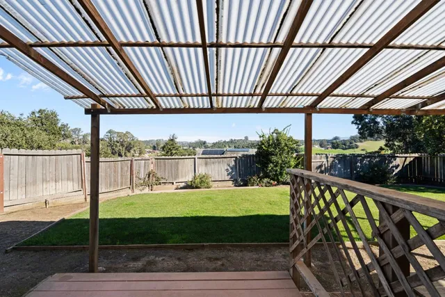 a view of a porch with a yard