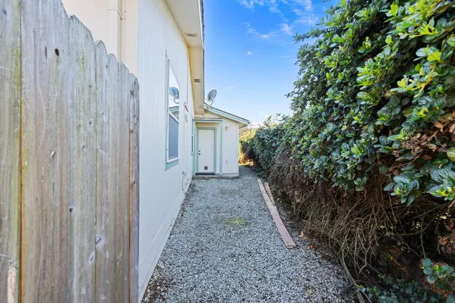 a view of a pathway with a house on both side
