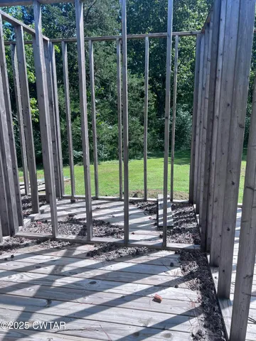 a view of a glass door and the balcony