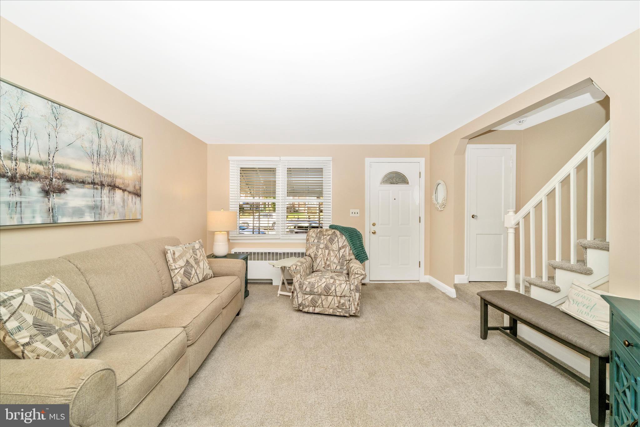3909 Colchester Road Baltimore, MD 21229 - Photo 4 of 27 a living room with furniture and a large window