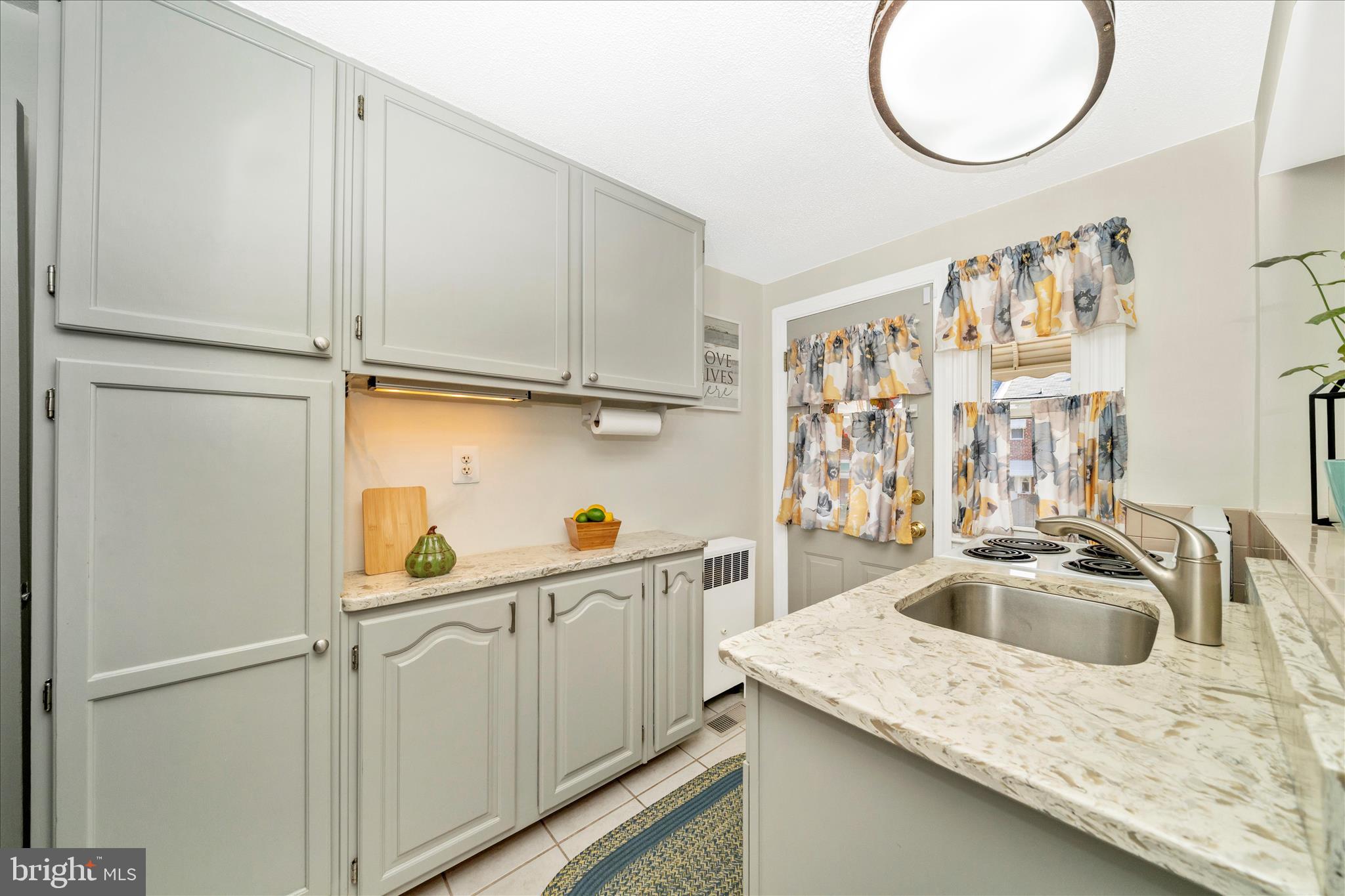 3909 Colchester Road Baltimore, MD 21229 - Photo 8 of 27 a kitchen with a sink and cabinets