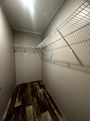 a bathroom with a double vanity sink toilet and a mirror