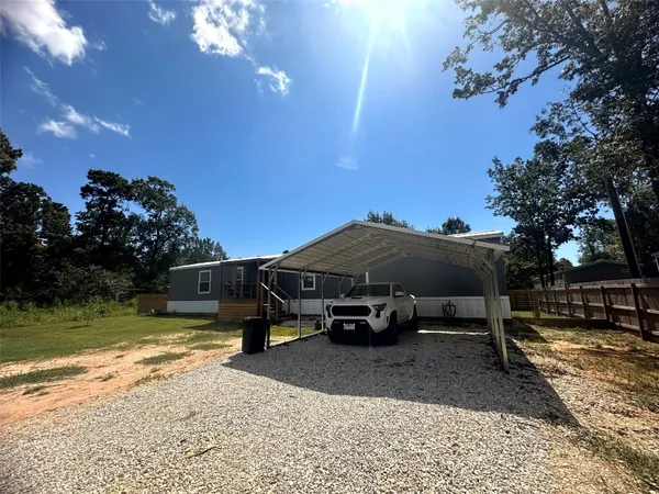 a view of backyard with tub