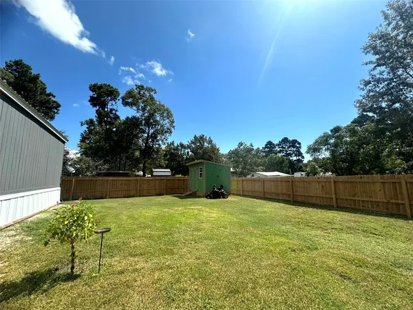a view of a house with basketball court