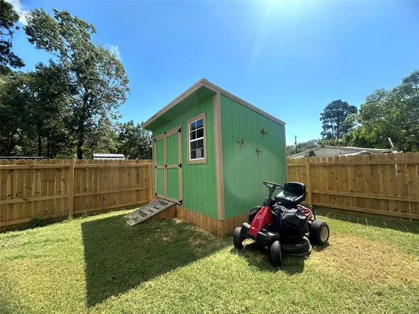 a view of a big house with a yard