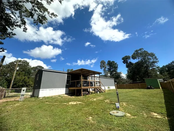 a kitchen with kitchen island a stove and a refrigerator