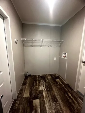a bathroom with a double vanity sink toilet and a mirror