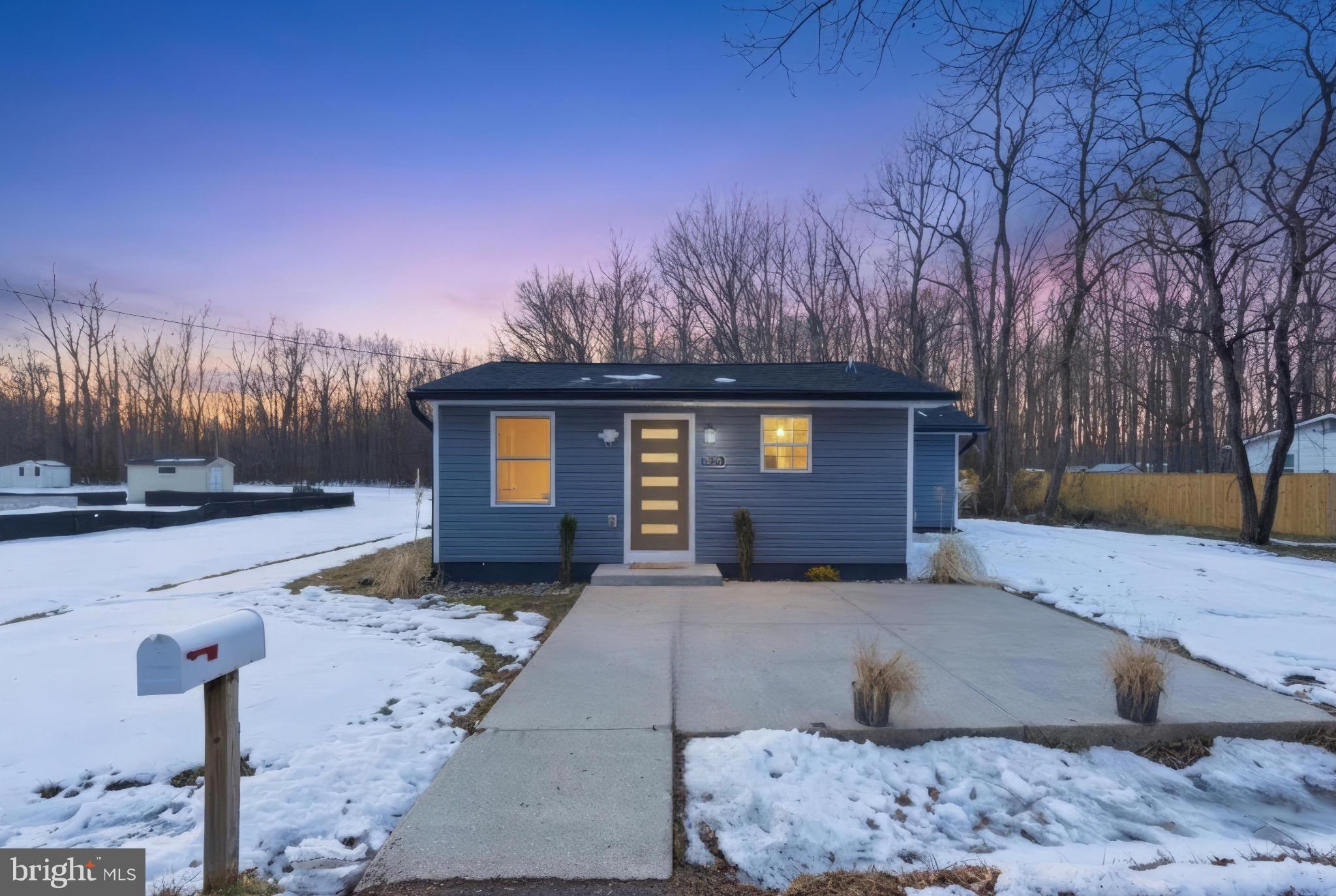 5218 Nick Road Shady Side, MD 20764 - Photo 23 of 24 a front view of a house with a yard