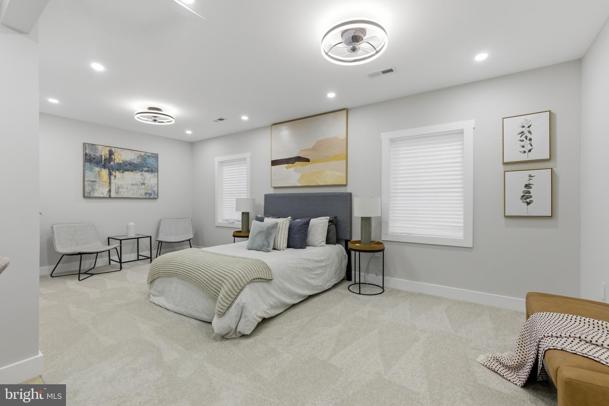 5218 Nick Road Shady Side, MD 20764 - Photo 10 of 24 a bedroom with a bed and a chandelier